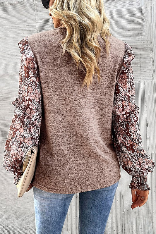 This floral blouse creates a charming and eclectic style
Ruffle detailing along the sleeves creates a playful and romantic vibe
Perfect blend of modern trends and feminine accents for a standout wardrobe piece
Puff sleeves add a touch of elegance and femininity