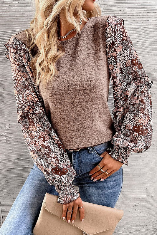 This floral blouse creates a charming and eclectic style
Ruffle detailing along the sleeves creates a playful and romantic vibe
Perfect blend of modern trends and feminine accents for a standout wardrobe piece
Puff sleeves add a touch of elegance and femininity