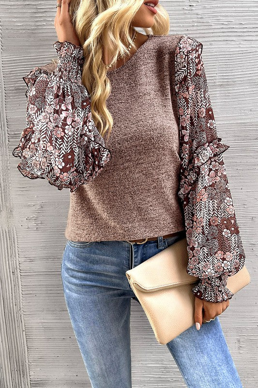 This floral blouse creates a charming and eclectic style
Ruffle detailing along the sleeves creates a playful and romantic vibe
Perfect blend of modern trends and feminine accents for a standout wardrobe piece
Puff sleeves add a touch of elegance and femininity