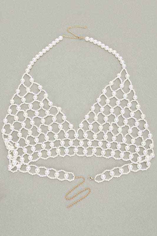 Faux Pearl Crochet Braided HalteUpgrade your summer style with our Faux Pearl Crochet Braided Halter Top. The intricate braided detailing adds a touch of elegance, while the faux pearl embellishments elevate the look. Perfect for any occasion, this crop top will make you stand out with its unique style