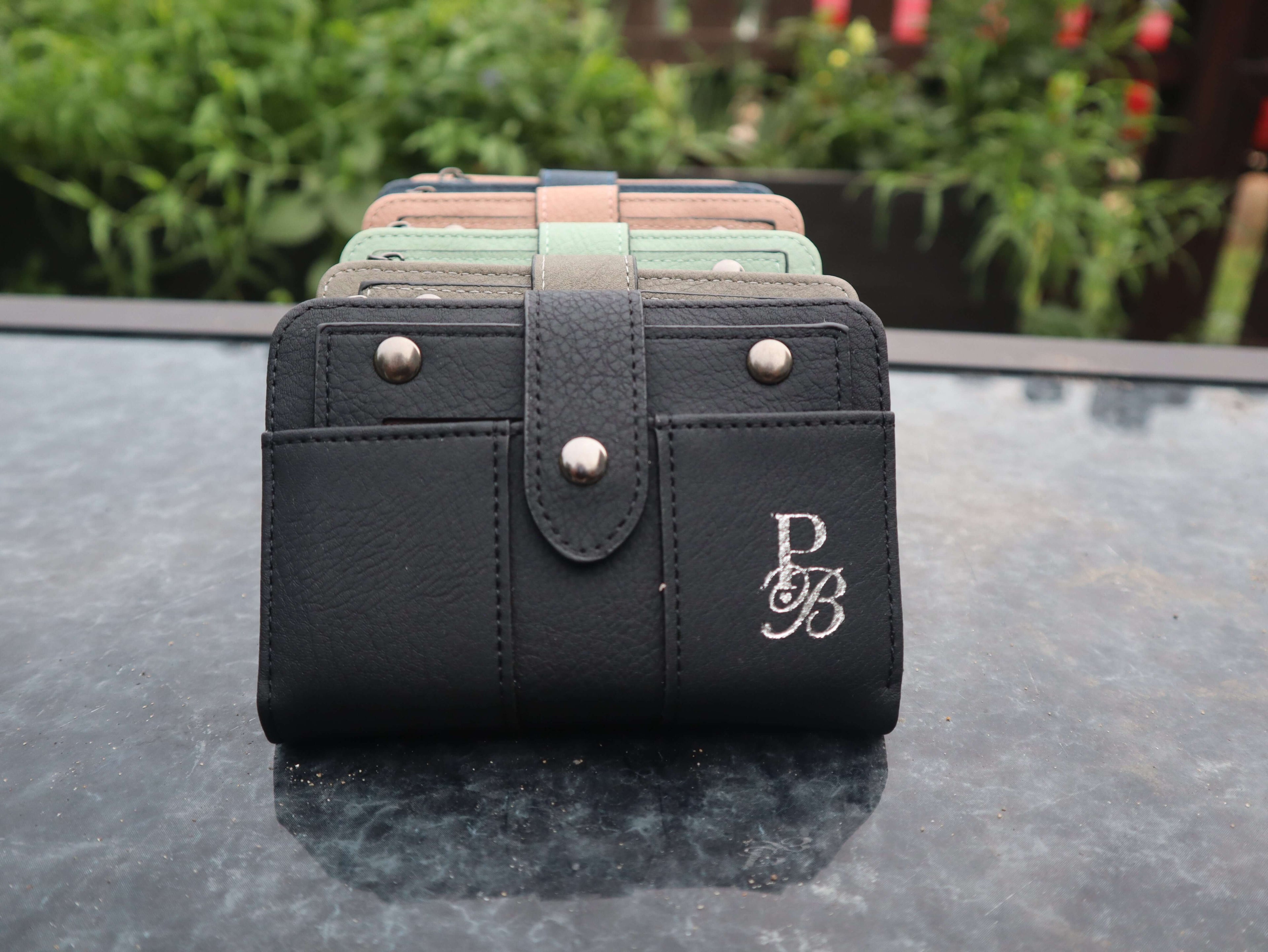Discover the Prestige Boutique Mini Book Wallet—a bold blend of style and function. Compact yet spacious, it keeps your essentials organized while making a fearless fashion statement. Perfect for those who dare to carry less but demand more.