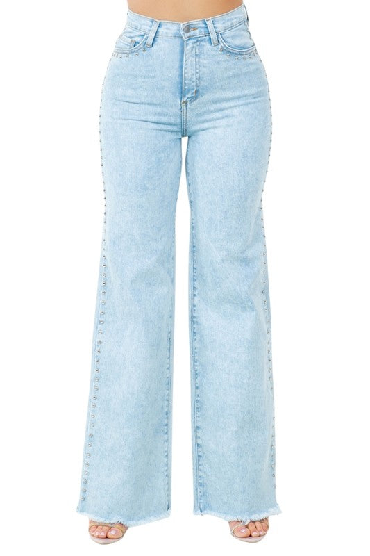 Light blue denim jeans on a white background