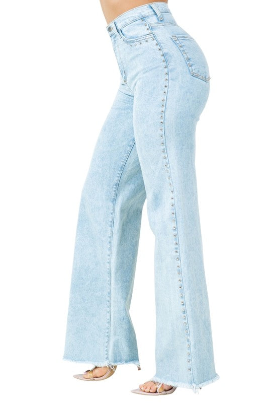 Light blue flared jeans on a white background