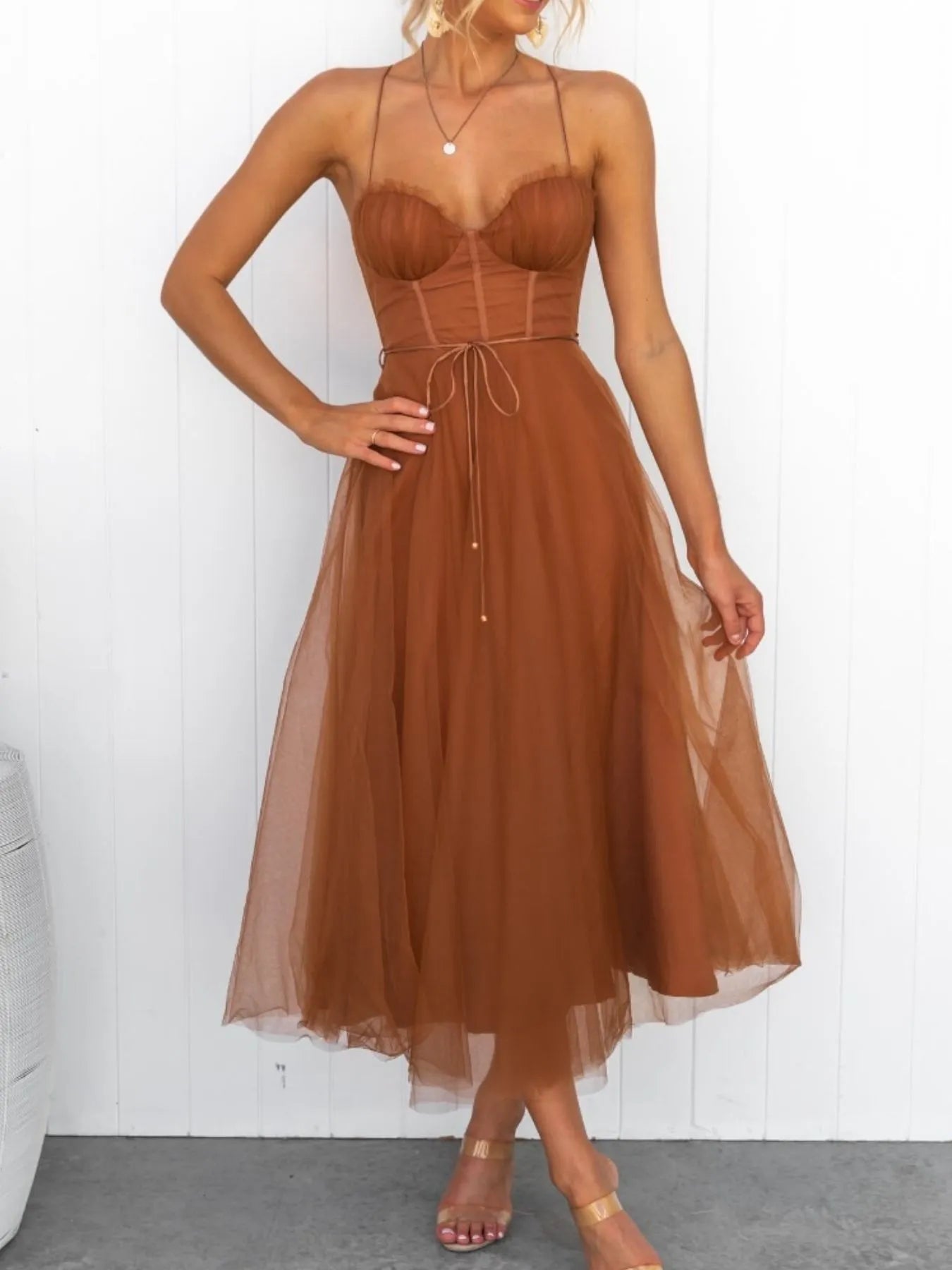 Turn heads with the Sweetheart Neck Tulle Midi Dress, designed to captivate. Its delicate tulle fabric and flattering sweetheart neckline create a bold yet elegant silhouette, perfect for making a daring statement at any event. Embrace your confidence and let this dress highlight your fearless style.
