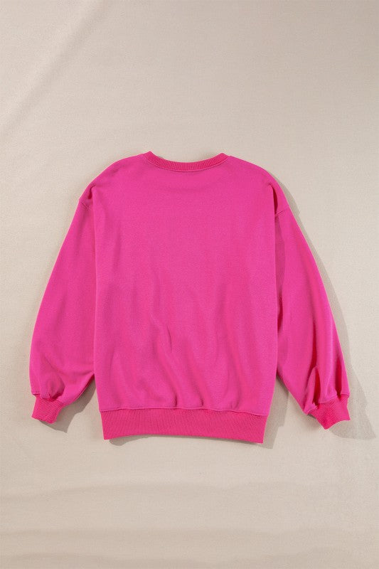 Pink sweatshirt on a beige background