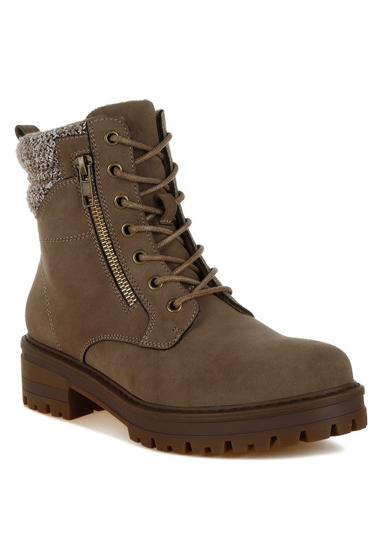 Brown boot with a zipper on a white background