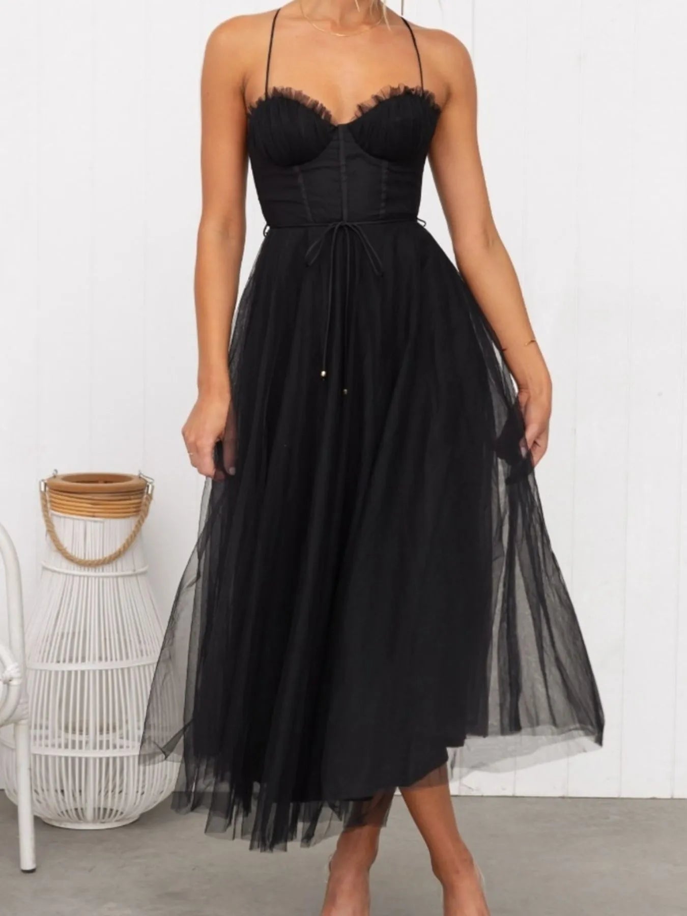 Turn heads with the Sweetheart Neck Tulle Midi Dress, designed to captivate. Its delicate tulle fabric and flattering sweetheart neckline create a bold yet elegant silhouette, perfect for making a daring statement at any event. Embrace your confidence and let this dress highlight your fearless style.