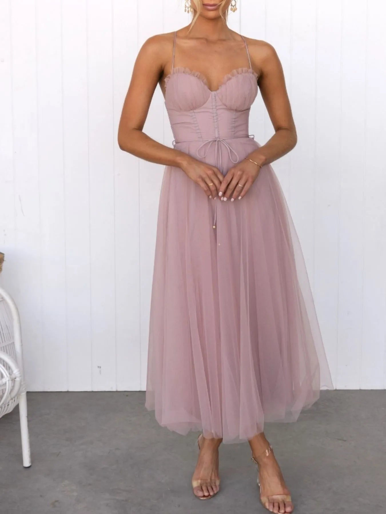 Turn heads with the Sweetheart Neck Tulle Midi Dress, designed to captivate. Its delicate tulle fabric and flattering sweetheart neckline create a bold yet elegant silhouette, perfect for making a daring statement at any event. Embrace your confidence and let this dress highlight your fearless style. pink dress