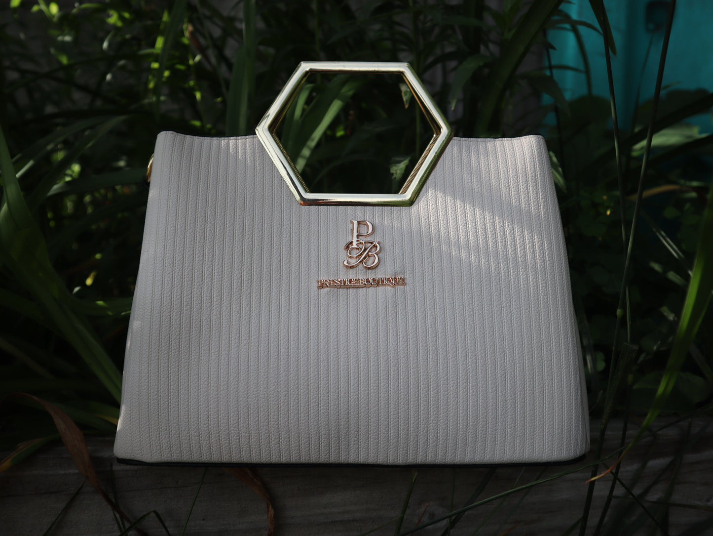 Make a fearless statement with The Hex Appeal Prestige Boutique Crossbody Handbag. This daring accessory combines high-end sophistication with practical design. Its large capacity and secure zipper keep your essentials safe while making a bold statement wherever you go. Perfect for those who refuse to blend in. Business casual attire. Style. Fashion. Purse