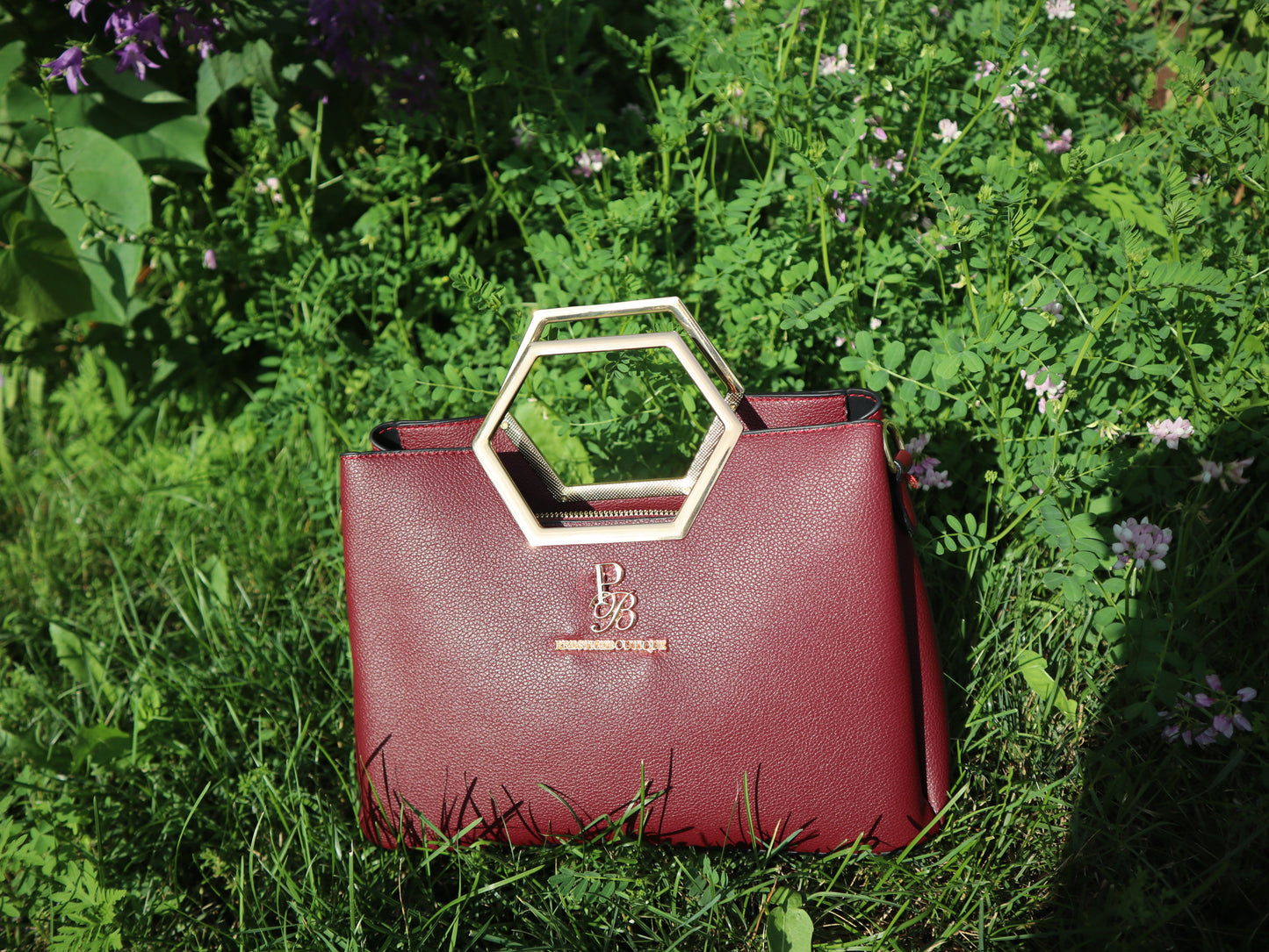 Make a fearless statement with The Hex Appeal Prestige Boutique Crossbody Handbag. This daring accessory combines high-end sophistication with practical design. Its large capacity and secure zipper keep your essentials safe while making a bold statement wherever you go. Perfect for those who refuse to blend in. burgundy wine red purse