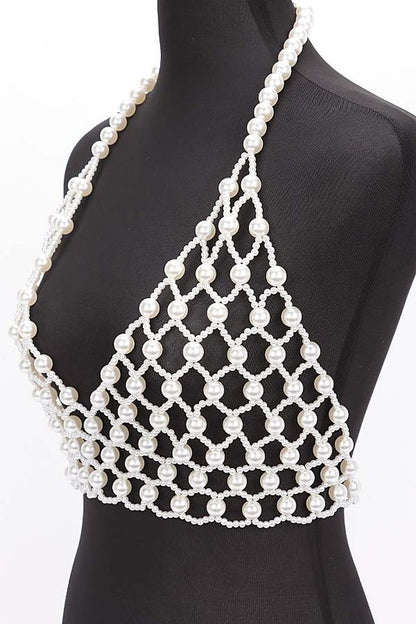Faux Pearl Crochet Braided HalteUpgrade your summer style with our Faux Pearl Crochet Braided Halter Top. The intricate braided detailing adds a touch of elegance, while the faux pearl embellishments elevate the look. Perfect for any occasion, this crop top will make you stand out with its unique style