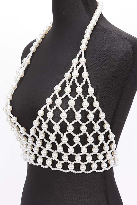 Faux Pearl Crochet Braided HalteUpgrade your summer style with our Faux Pearl Crochet Braided Halter Top. The intricate braided detailing adds a touch of elegance, while the faux pearl embellishments elevate the look. Perfect for any occasion, this crop top will make you stand out with its unique style