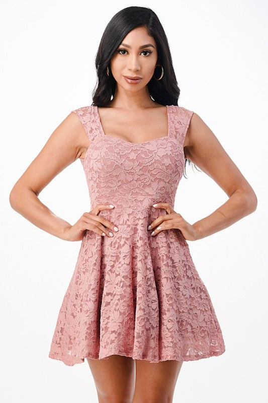 Short formal fit and flare lace dress in blush pink, perfect for homecoming or prom, featuring sleeveless design and tulle embellishment.