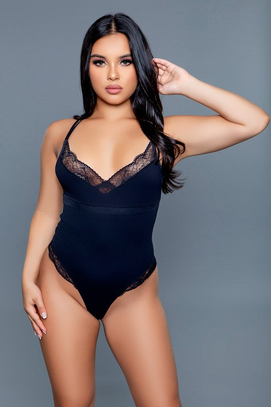 Maisie jersey bodysuit with lace trim, designed to offer both comfort and elegance. This bodysuit features a soft, stretchy jersey fabric that provides a snug, comfortable fit. The addition of delicate lace trim along the neckline and leg openings adds a touch of sophistication and feminine charm, enhancing the overall aesthetic of the garment.