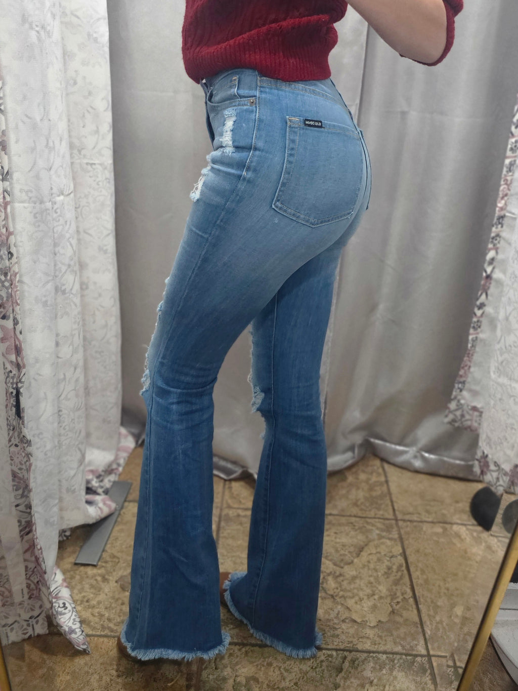 Model showcasing Premium USA Denim Bootcut High Rise Jeans from the side, highlighting the fit and quality.