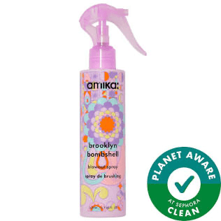 Amika Brooklyn Bombshell hair spray bottle with colorful label on a white background