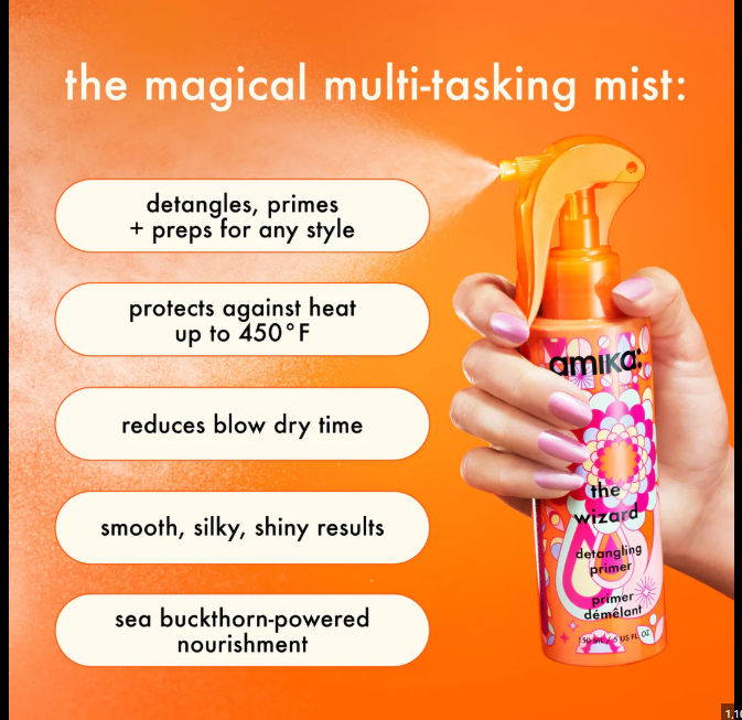 Amika hair mist bottle held by a hand with product features listed on an orange background
