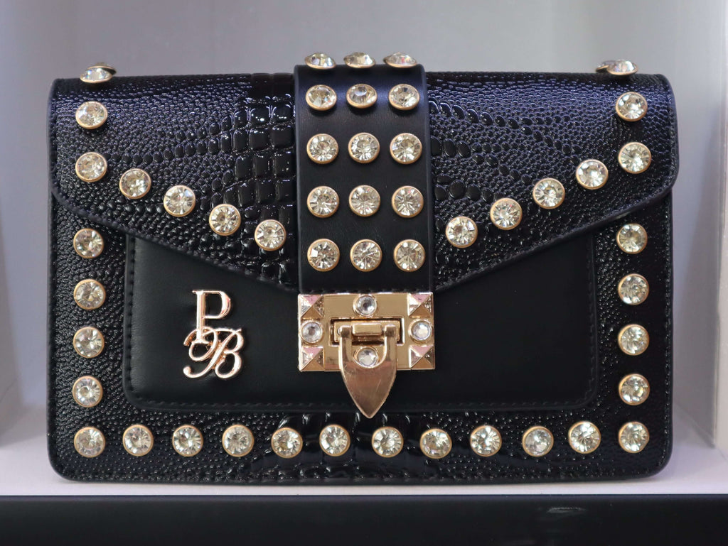 Black studded handbag with a brand logo on a white background