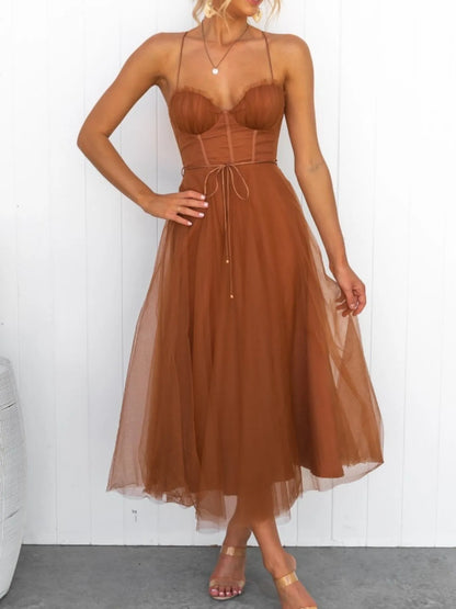 Turn heads with the Sweetheart Neck Tulle Midi Dress, designed to captivate. Its delicate tulle fabric and flattering sweetheart neckline create a bold yet elegant silhouette, perfect for making a daring statement at any event. Embrace your confidence and let this dress highlight your fearless style.