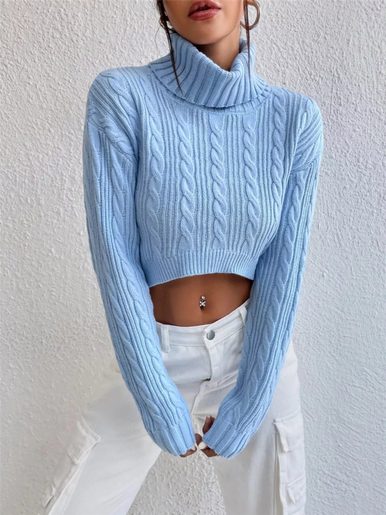 Cable-Knit Turtleneck Long Sleeve Sweater in light blue color, featuring a cropped design and cable-knit texture.