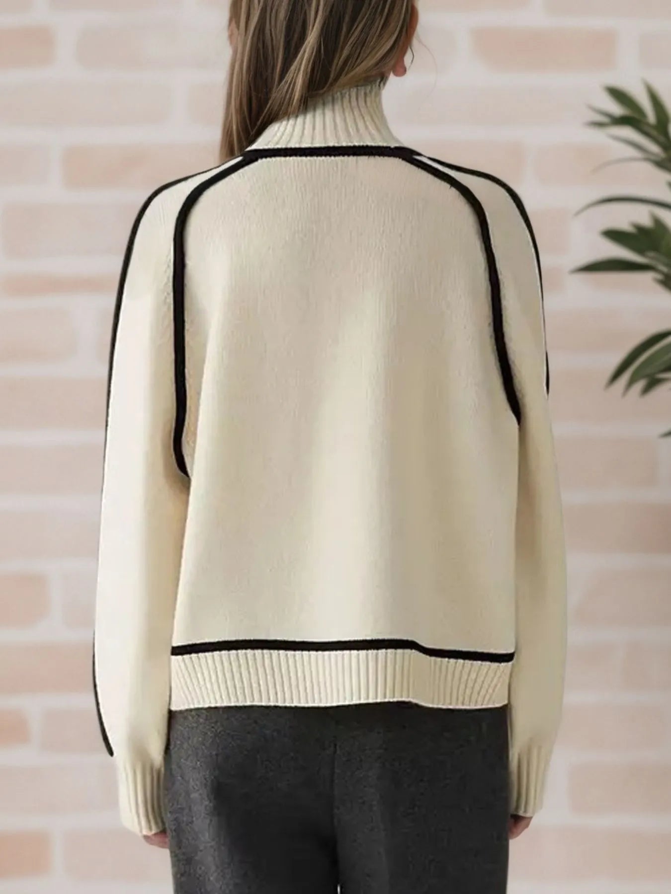 Back view of the Contrast Trim Turtleneck Sweater showcasing its stylish design and comfortable fit.