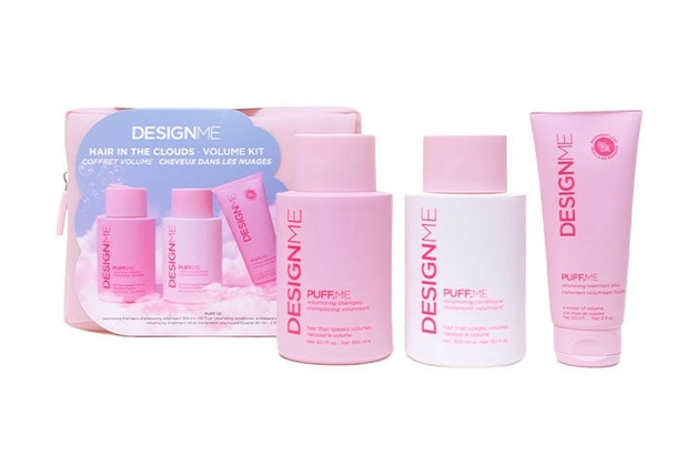 Set of pink hair care products with packaging labeled 'Design Me' on a white background