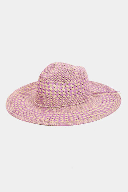 The Checkered Straw Weave Sun Hat is a stylish and practical accessory for sunny days. Its checkered pattern adds a touch of charm and sophistication to your outfit. Made of straw weave, this hat provides breathability and keeps you cool in warm weather. The wide brim offers ample shade and sun protection for your face and neck. Perfect for beach days, picnics, or outdoor events, this hat is both fashionable and functional. Stay chic and shielded from the sun with this trendy checkered straw weave sun hat.