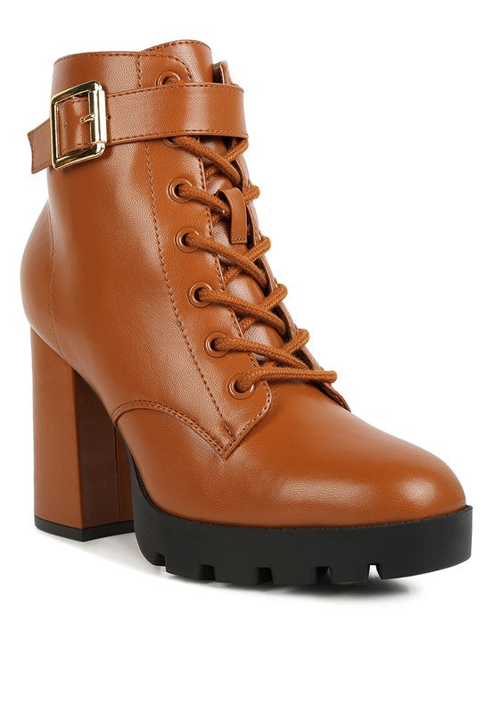 Brown leather boot with a block heel on a white background