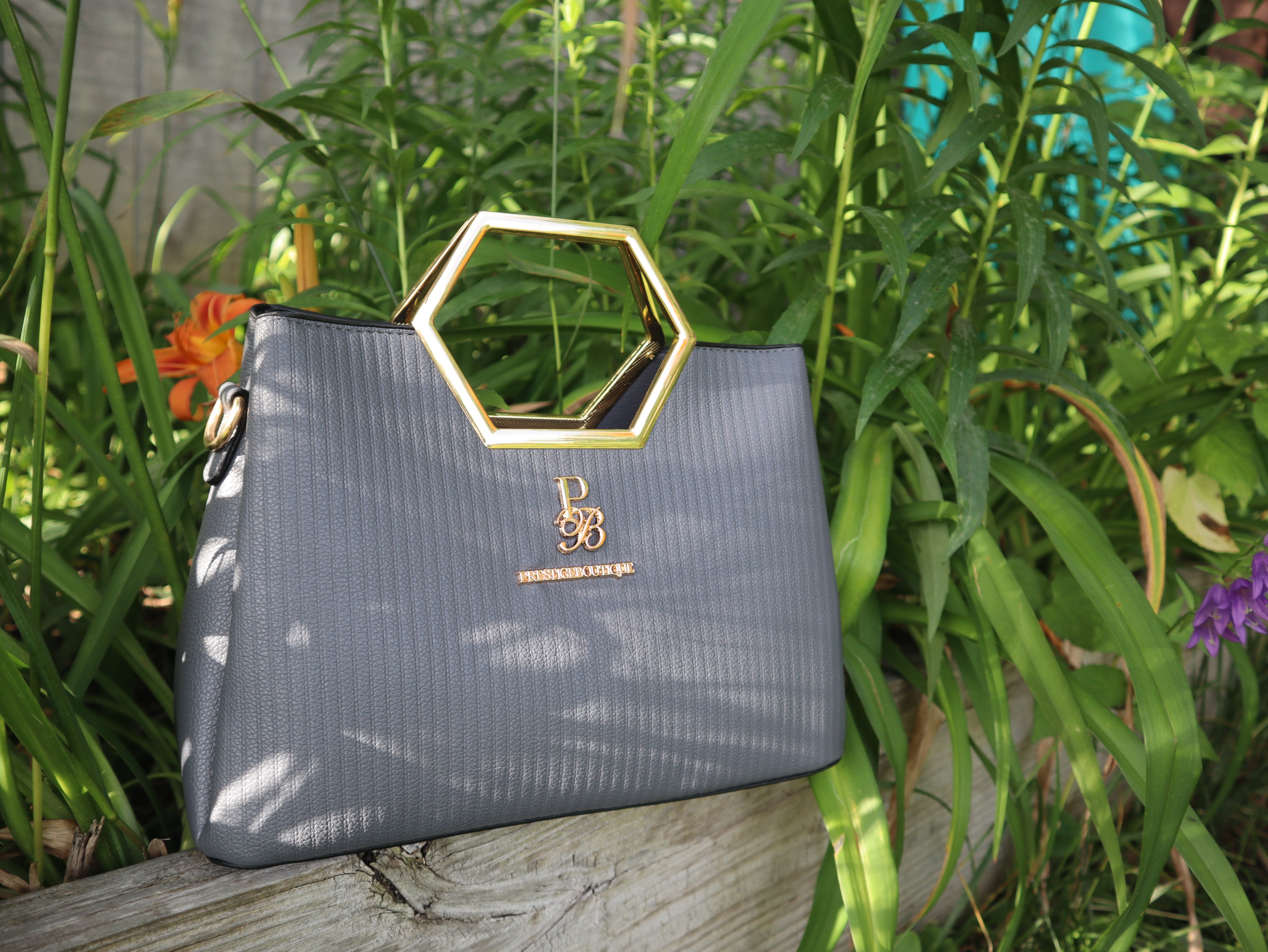 Make a fearless statement with The Hex Appeal Prestige Boutique Crossbody Handbag. This daring accessory combines high-end sophistication with practical design. Its large capacity and secure zipper keep your essentials safe while making a bold statement wherever you go. Perfect for those who refuse to blend in. grey purse. Women's style inspo. Women's purse