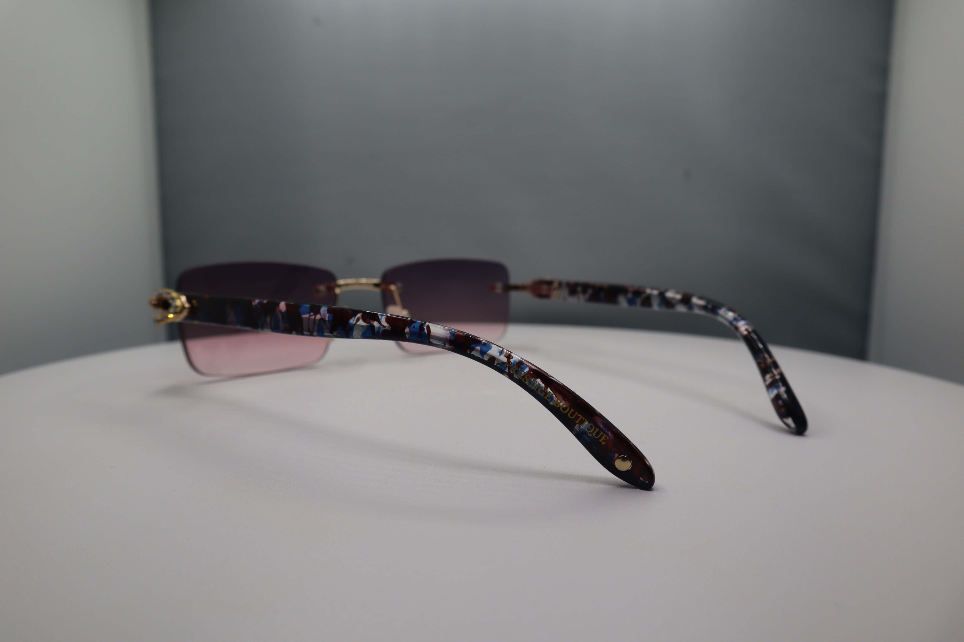 Prestige Boutique Pink Floral Fashionista Sunglasses with unique patterned arms and gradient lenses.