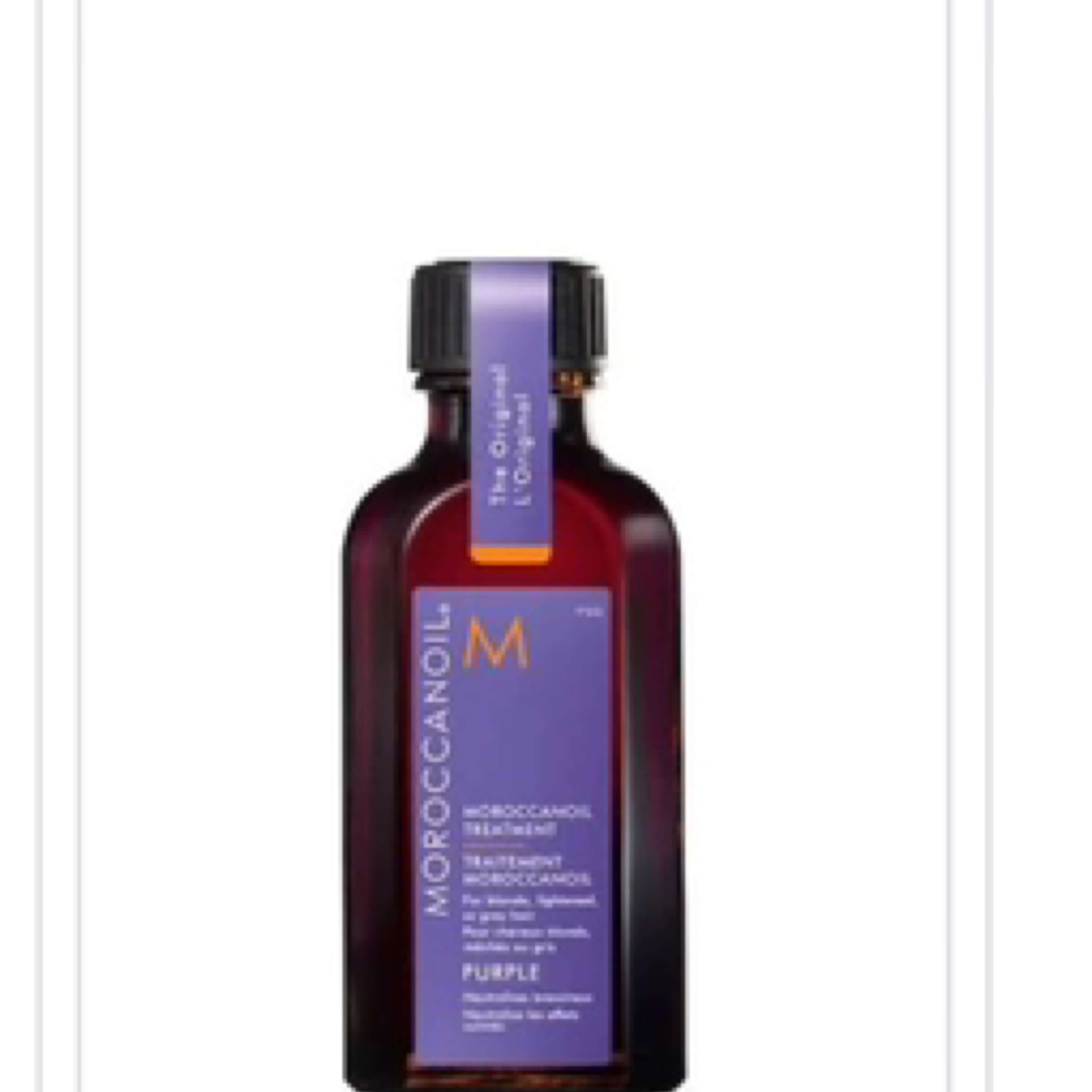 Moroccanoil hair treatment bottle on a white background