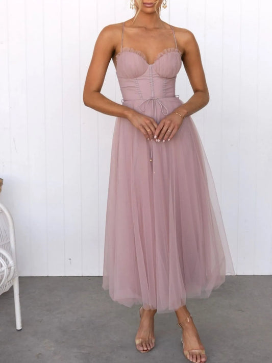 Turn heads with the Sweetheart Neck Tulle Midi Dress, designed to captivate. Its delicate tulle fabric and flattering sweetheart neckline create a bold yet elegant silhouette, perfect for making a daring statement at any event. Embrace your confidence and let this dress highlight your fearless style. pink dress