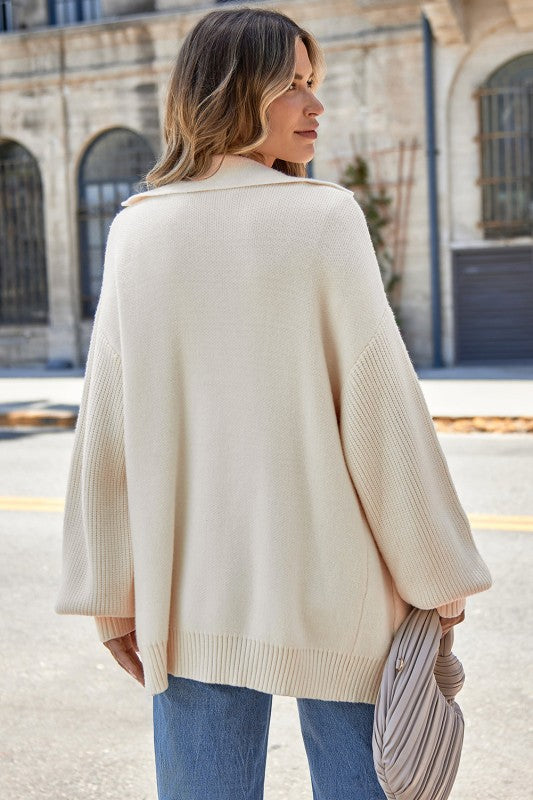 Woman wearing a Solid Lapel Collar Single Button Sweater Cardigan, showcasing its soft knit and elegant design.