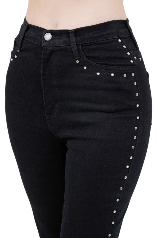 Close-up of the Studded Mom Jean in Black Denim featuring hand-pressed studs and flattering high-waisted design.