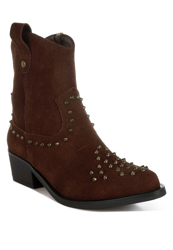 Brown suede boot with studded details on a white background
