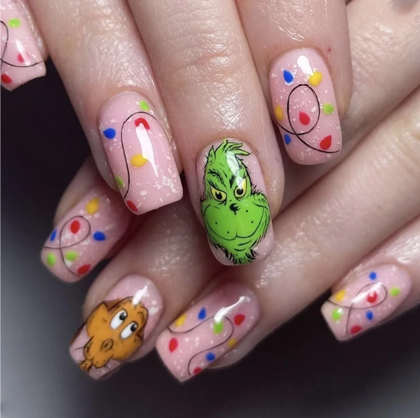 The Grinch Christmas Glue On Press On Nails featuring festive Christmas lights and character designs.