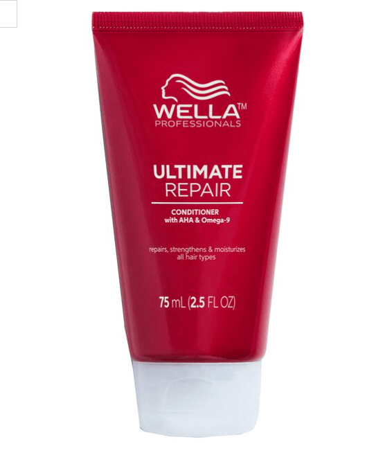 Red Wella Professionals Ultimate Repair conditioner tube on a white background