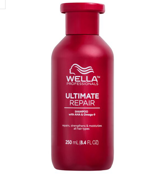 A red bottle of Wella Ultimate Repair Shampoo with a white label, containing 250 ml of product.