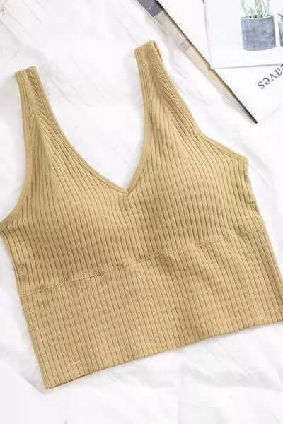 Beige ribbed tank top on a white background