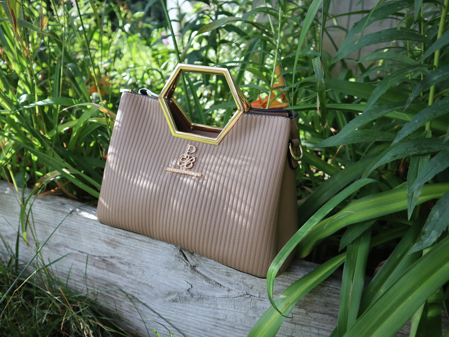 Make a fearless statement with The Hex Appeal Prestige Boutique Crossbody Handbag. This daring accessory combines high-end sophistication with practical design. Its large capacity and secure zipper keep your essentials safe while making a bold statement wherever you go. Perfect for those who refuse to blend in. khaki beige purse