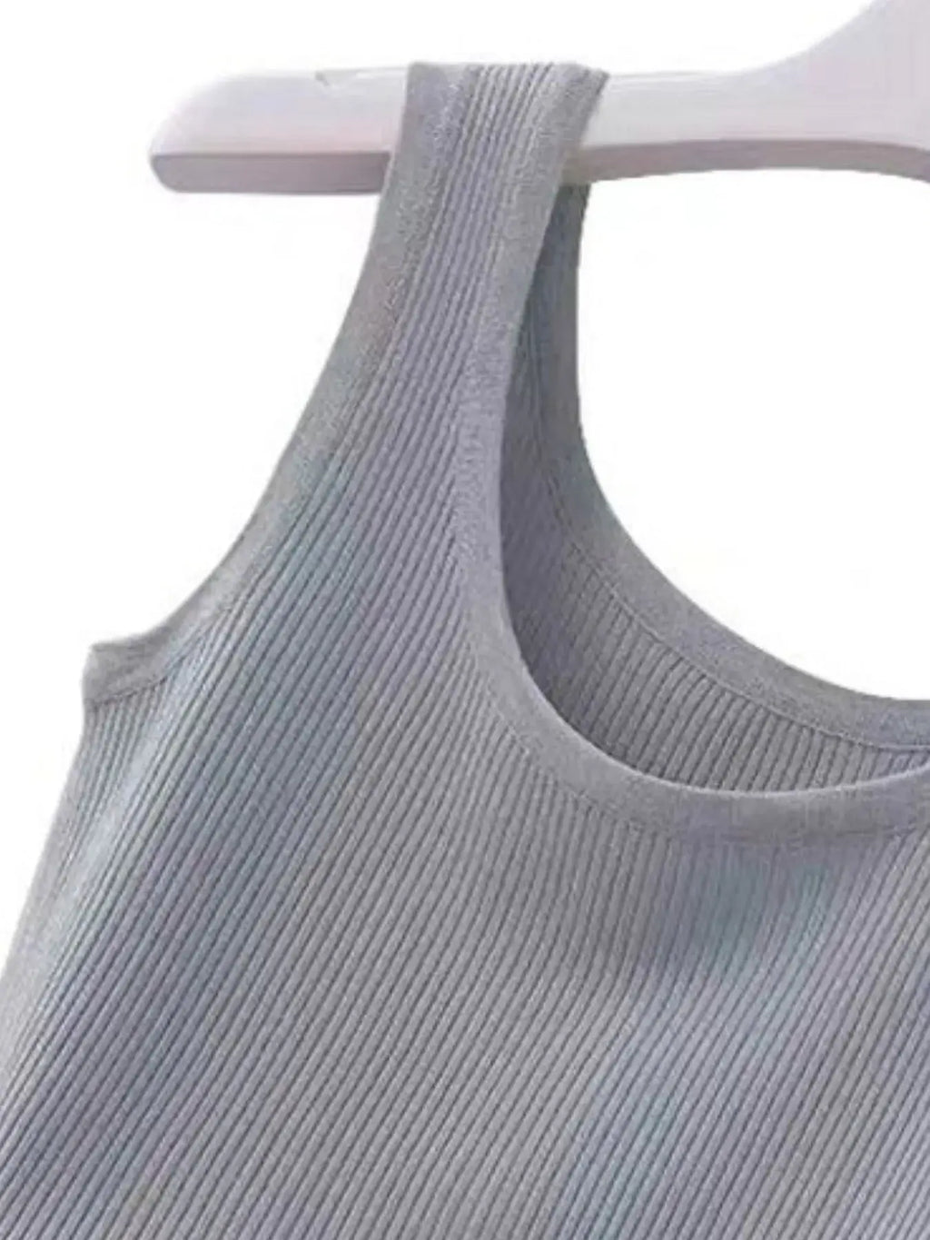 Gray ribbed tank top on a white hanger against a white background