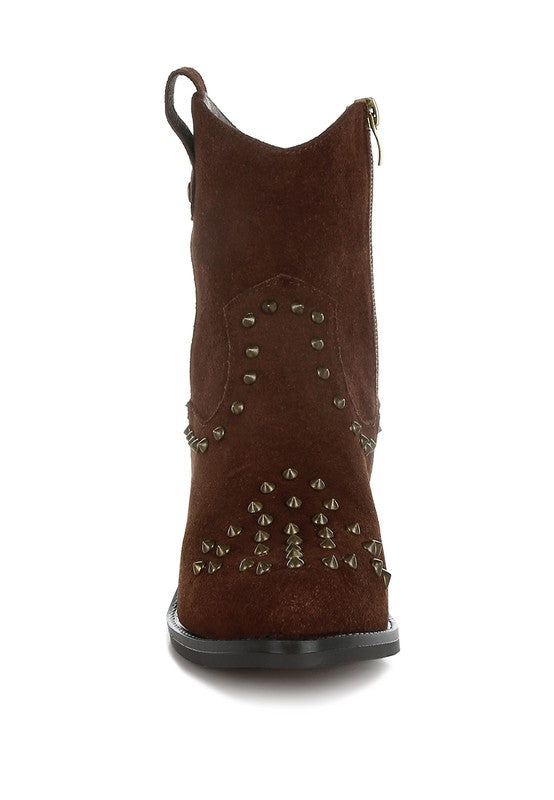Brown suede boot with studded details on a white background