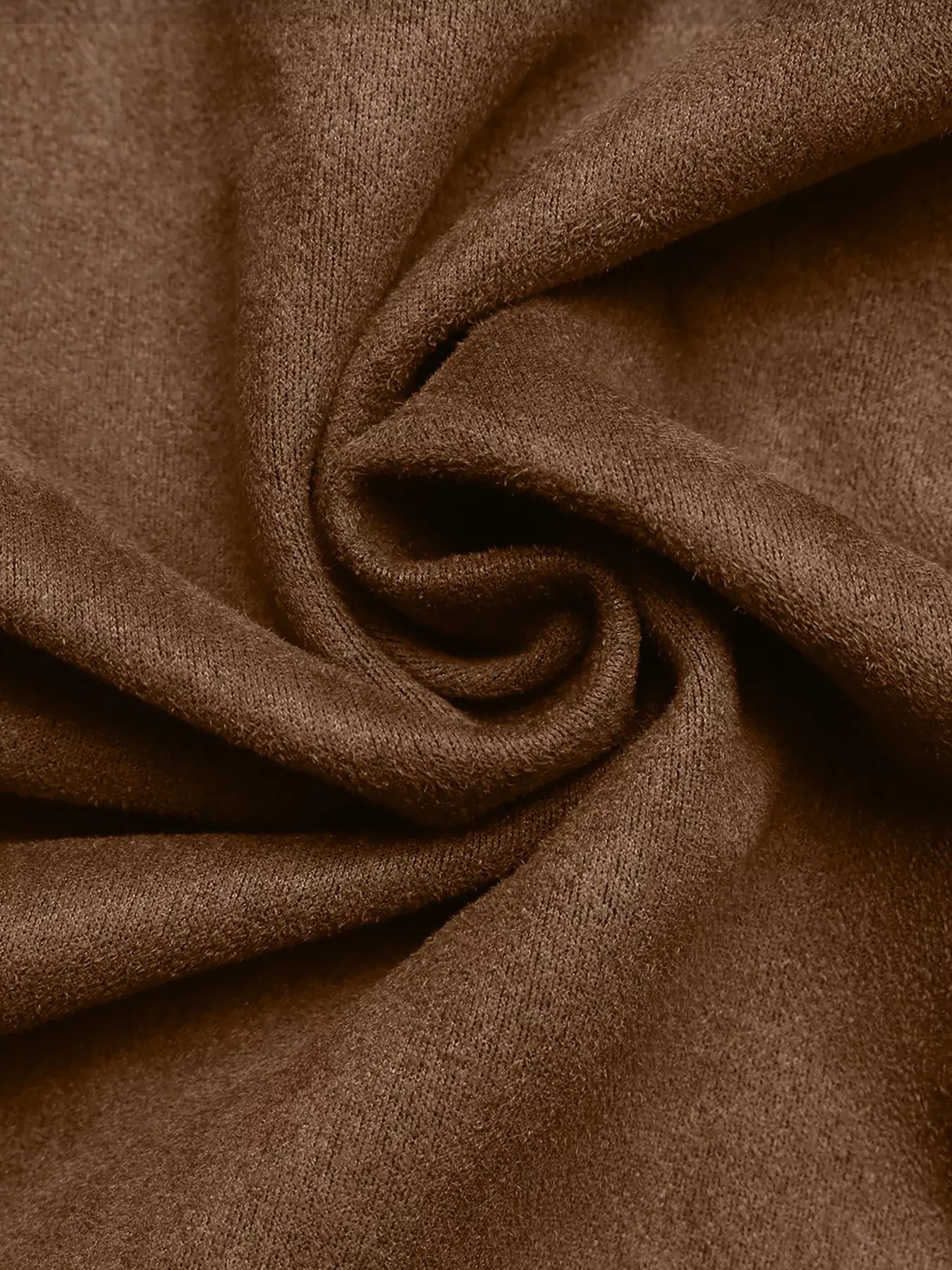 Close-up of brown fabric with folds