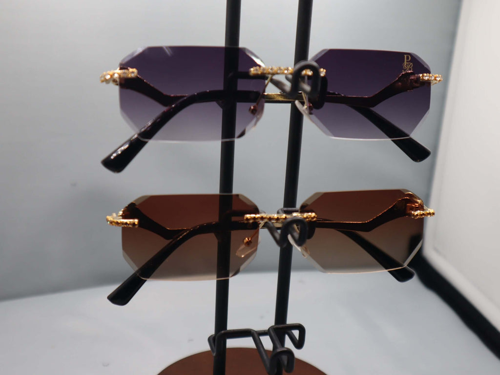 Prestige Boutique Queen Of The Jungle Women's sunglasses on display, featuring beveled frames and elegant design.
