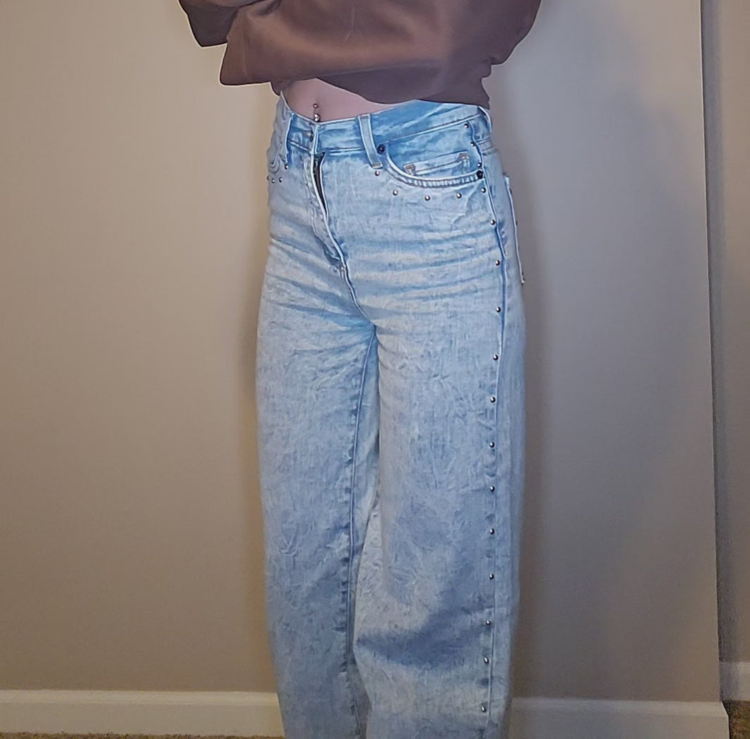 Brooklyn Studded BootCut High Rise Jeans showcasing light wash denim and studded details on the sides.