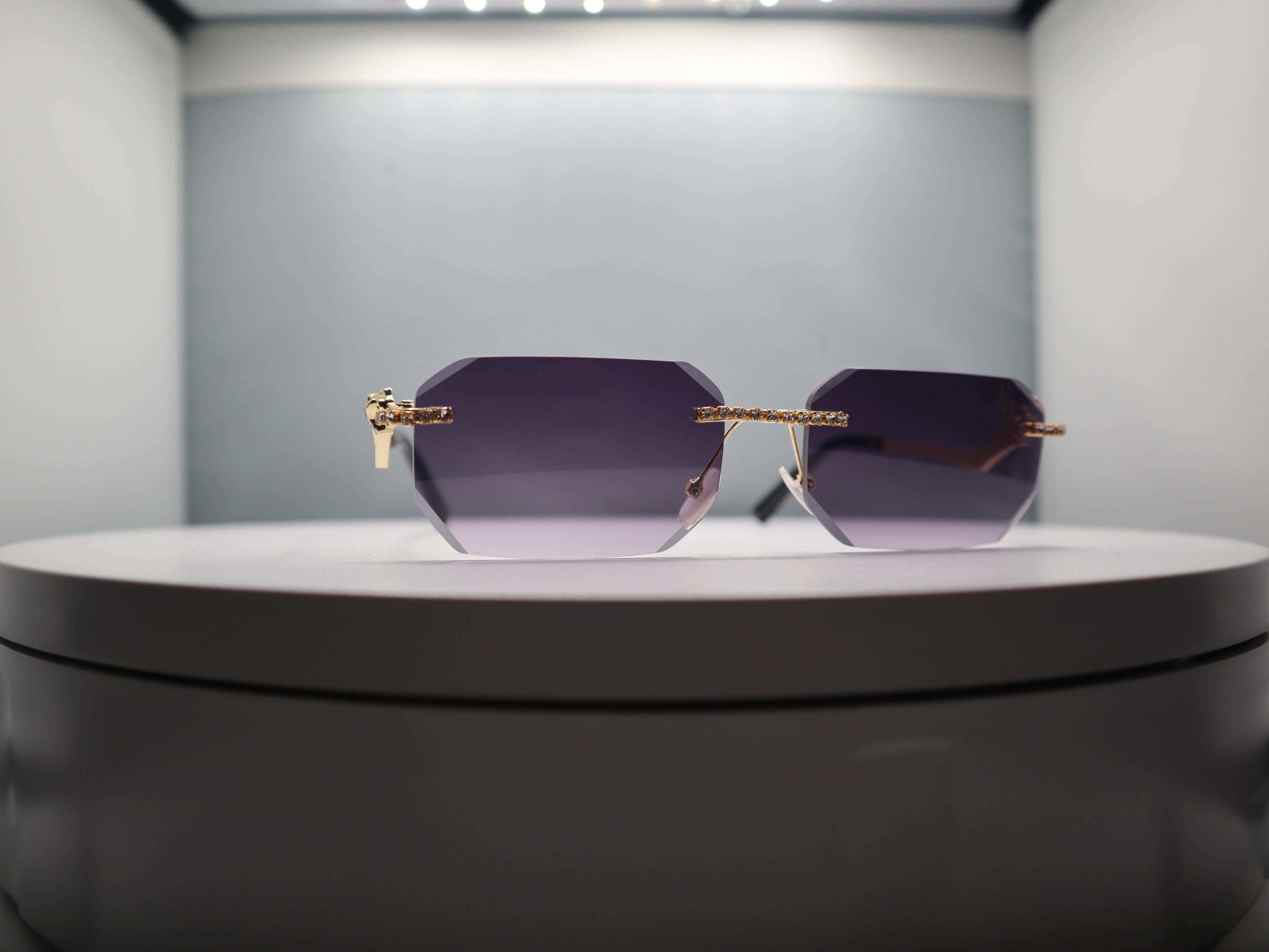 Elegant Prestige Boutique Queen Of The Jungle sunglasses with beveled frames and edgy design.