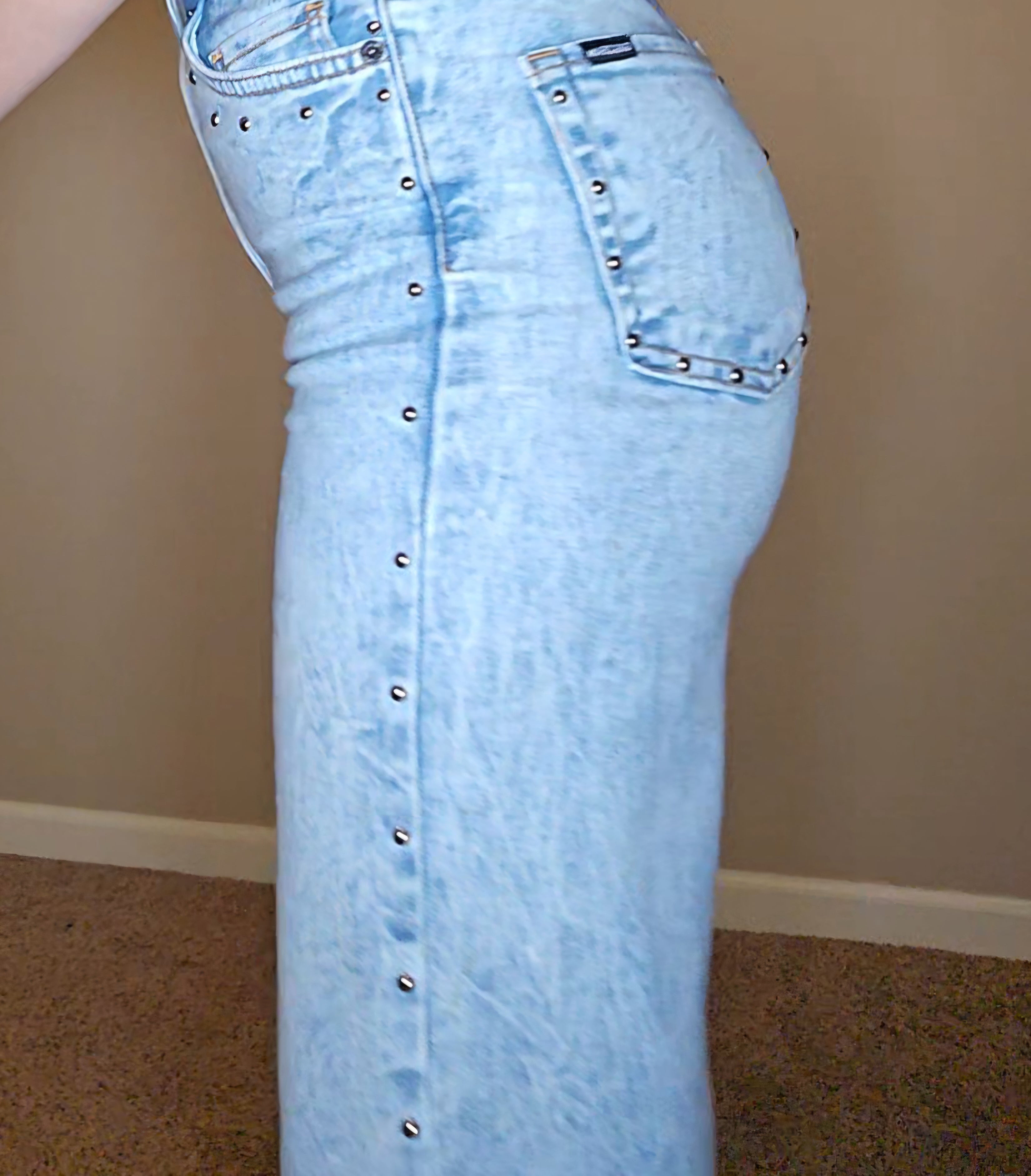 Brooklyn Studded BootCut High Rise Jeans featuring light wash denim and studded detail visible from the side.