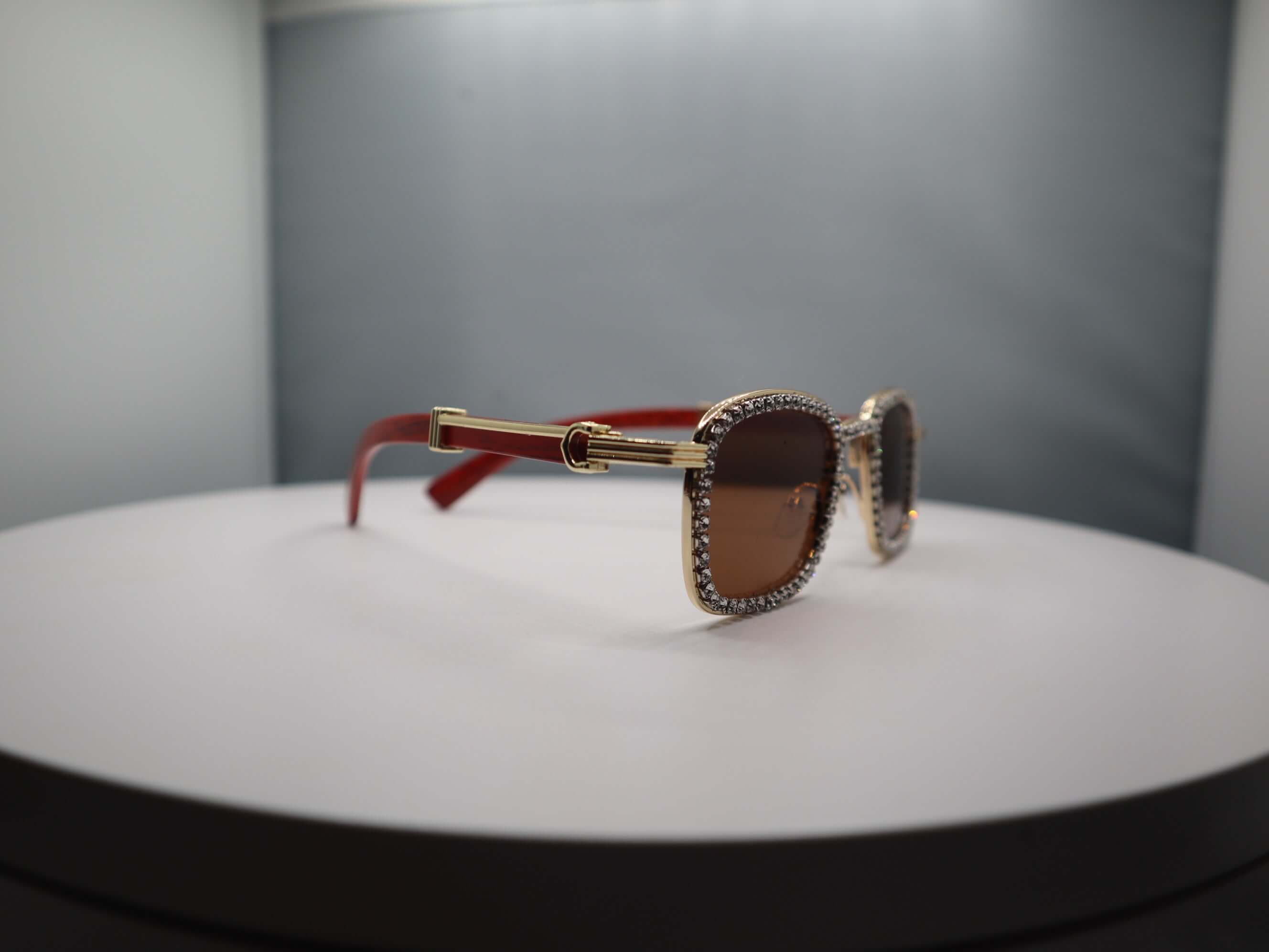 Total Gem women's sunglasses with rhinestone details and red arms, perfect for sun protection and chic style.