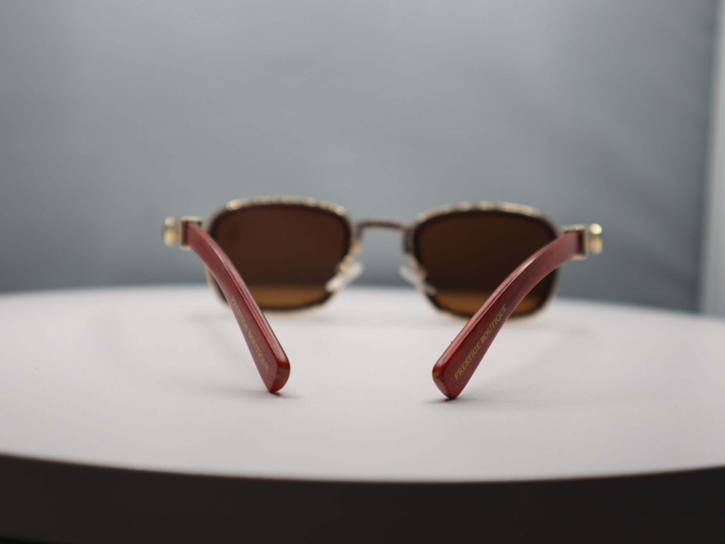 Total Gem Women's Sunglasses with rhinestone detailing and stylish red arms, perfect for chic sun protection.