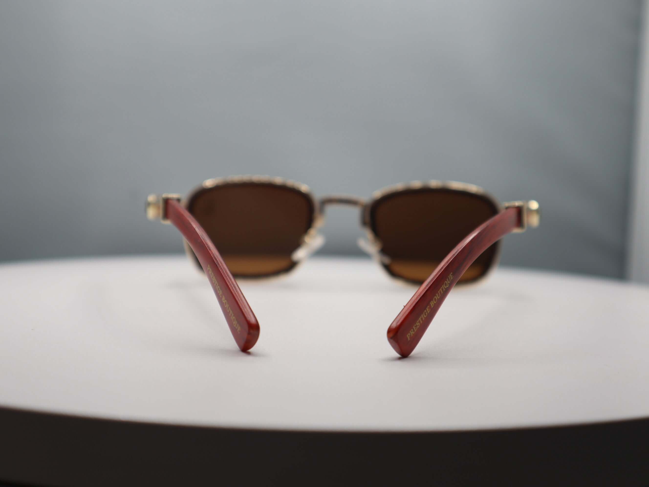 Total Gem Women's Sunglasses with rhinestone detailing and stylish red arms, perfect for chic sun protection.